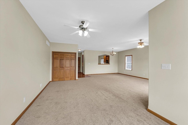 2104A Lucille Ln, Mahomet, IL 61853 - carpeted empty room with ceiling fan and a chandelier