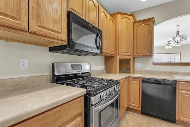 2104A Lucille Ln, Mahomet, IL 61853 - kitchen with black appliances, light countertops, light tile patterned flooring, a ceiling fan, and pendant lighting