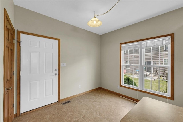 2104A Lucille Ln, Mahomet, IL 61853 - unfurnished room featuring baseboards and light tile patterned floors