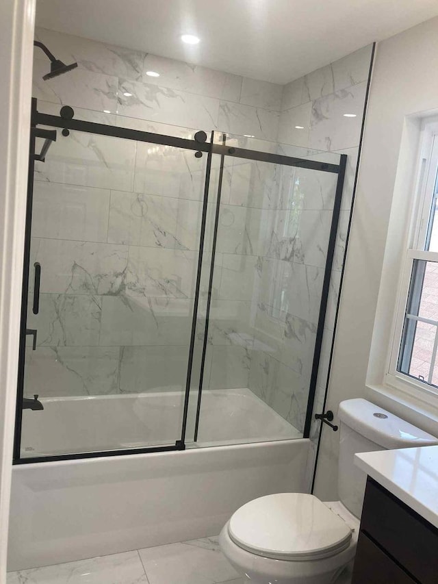 3431 N Kostner Ave, Chicago, IL 60641 - full bathroom featuring shower / bath combination with glass door, vanity, toilet, and marble look tile flooring