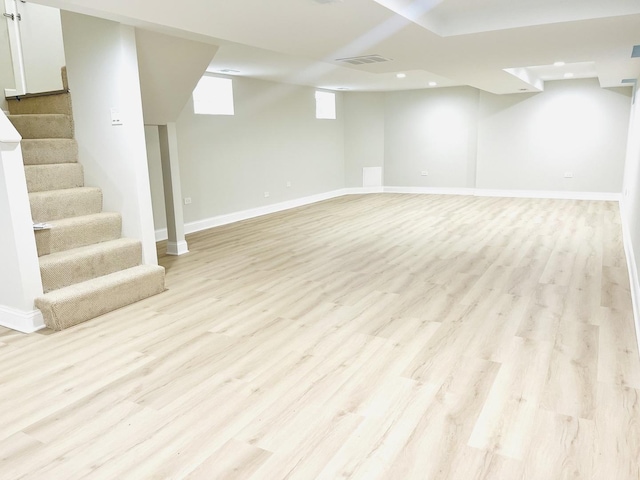 3431 N Kostner Ave, Chicago, IL 60641 - below grade area featuring light wood-type flooring, stairs, baseboards, and recessed lighting