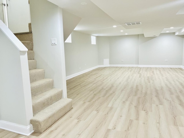 3431 N Kostner Ave, Chicago, IL 60641 - below grade area with recessed lighting, light wood-style floors, baseboards, and stairway