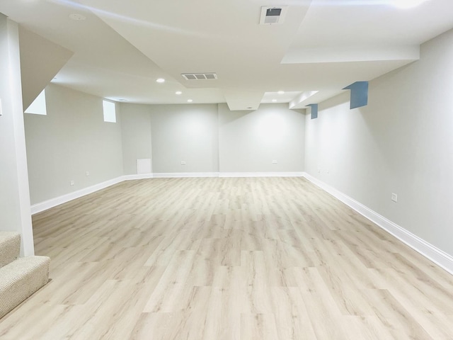 3431 N Kostner Ave, Chicago, IL 60641 - finished below grade area with recessed lighting, light wood-style floors, and baseboards
