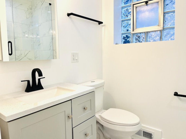 3431 N Kostner Ave, Chicago, IL 60641 - bathroom featuring vanity, toilet, and a shower with door