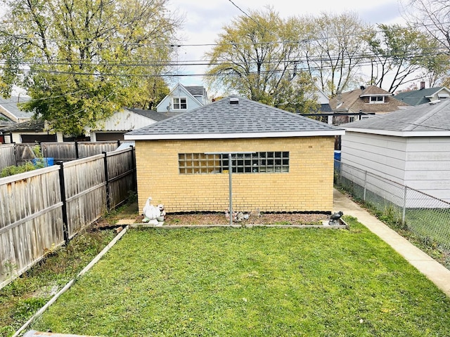 3431 N Kostner Ave, Chicago, IL 60641 - back of property featuring a shingled roof and brick siding
