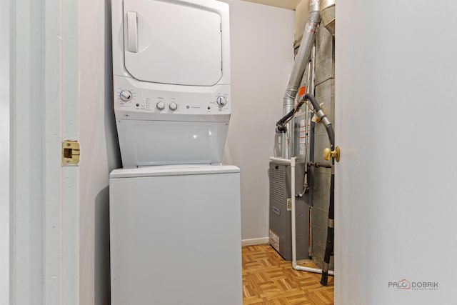 557 E Shag Bark Ln Unit H, Streamwood, IL 60107 - laundry area with stacked washer / dryer