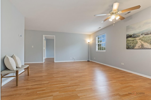 557 E Shag Bark Ln Unit H, Streamwood, IL 60107 - spare room featuring light wood-type flooring, ceiling fan, baseboards, and vaulted ceiling