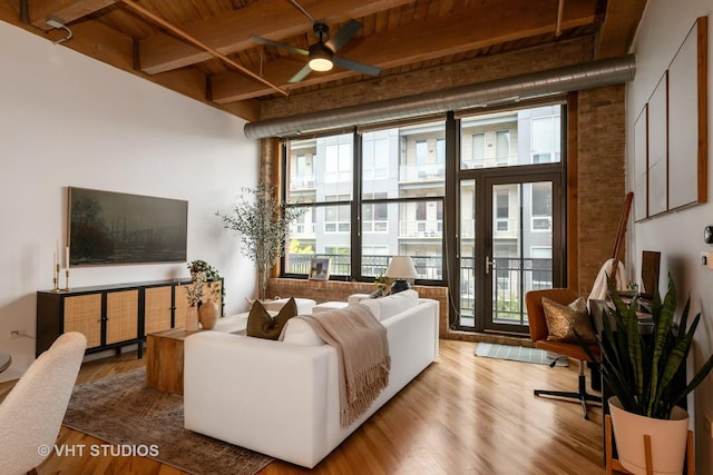 1040 W Adams St Unit 365, Chicago, IL 60607 - living room with ceiling fan, wood finished floors, and wooden ceiling with exposed beams