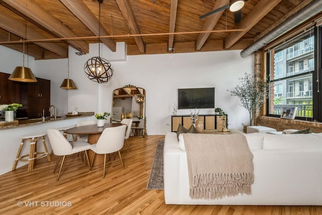 1040 W Adams St Unit 365, Chicago, IL 60607 - living area featuring wood ceiling with exposed beams, light wood-type flooring, and a chandelier