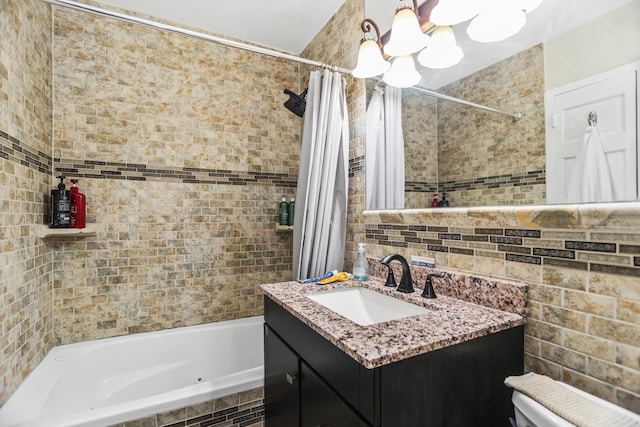 6301 N Sheridan Rd Unit 18E, Chicago, IL 60660 - full bathroom featuring a chandelier, tile walls, vanity, and a combined bath / shower with jetted tub