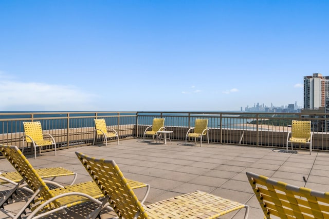 6301 N Sheridan Rd Unit 18E, Chicago, IL 60660 - view of patio / terrace with a water view and a city view