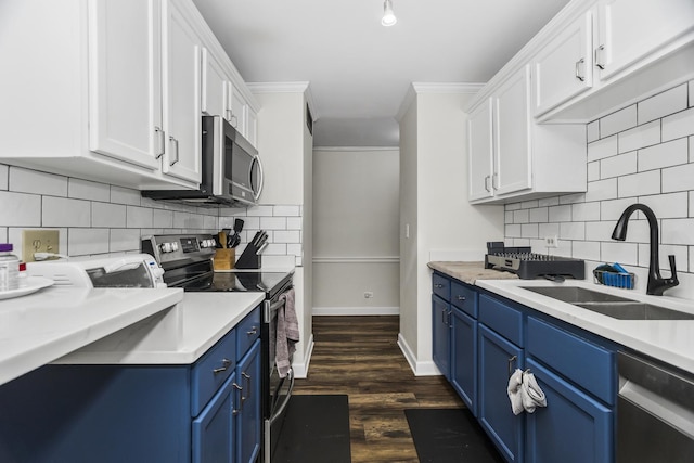 6301 N Sheridan Rd Unit 18E, Chicago, IL 60660 - kitchen with appliances with stainless steel finishes, blue cabinets, tasteful backsplash, white cabinets, and crown molding