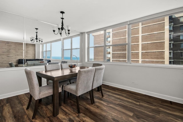 6301 N Sheridan Rd Unit 18E, Chicago, IL 60660 - dining area with a chandelier and dark wood-style flooring