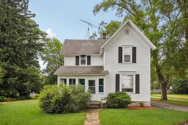 9014 Alden Rd, Harvard, IL 60033 - traditional-style house featuring a shingled roof, a front lawn, and a chimney
