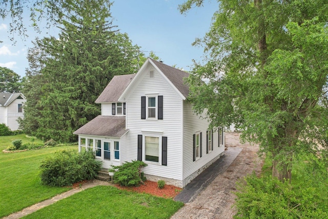 9014 Alden Rd, Harvard, IL 60033 - view of front facade featuring roof with shingles, asphalt driveway, and a front yard