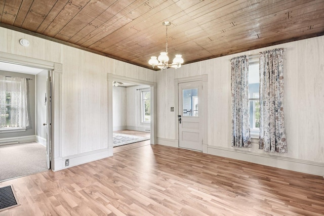 9014 Alden Rd, Harvard, IL 60033 - entryway with wooden ceiling, wood finished floors, a chandelier, and wood walls