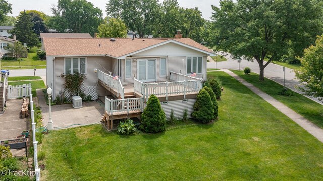 6560 Hillcrest Rd, Downers Grove, IL 60516 - rear view of house featuring a deck, roof with shingles, a patio area, and a chimney