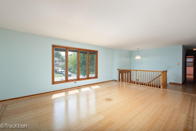 6560 Hillcrest Rd, Downers Grove, IL 60516 - spare room featuring wood finished floors and baseboards