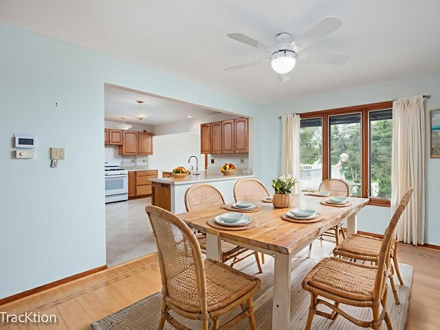6560 Hillcrest Rd, Downers Grove, IL 60516 - dining area with baseboards, ceiling fan, and light wood-style floors