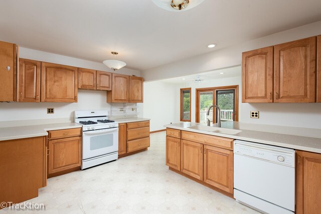 6560 Hillcrest Rd, Downers Grove, IL 60516 - kitchen featuring white appliances, a sink, light countertops, light floors, and recessed lighting