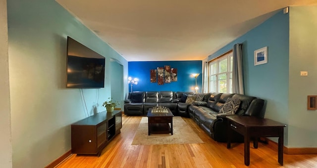 living room featuring light wood-style floors and baseboards