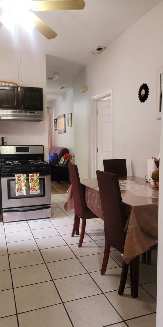 4751 S Hoyne Ave, Chicago, IL 60609 - dining room with light tile patterned flooring and ceiling fan