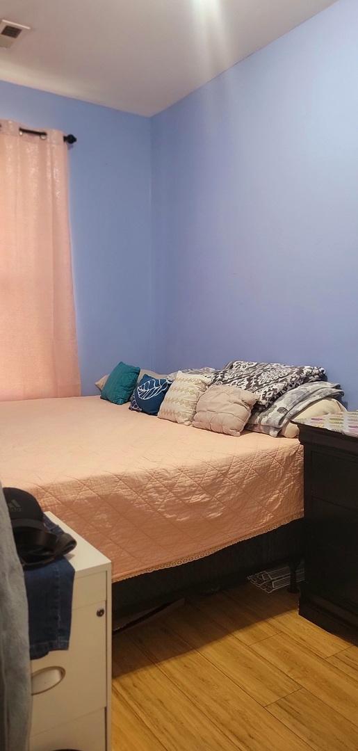 4751 S Hoyne Ave, Chicago, IL 60609 - bedroom with light wood-style flooring
