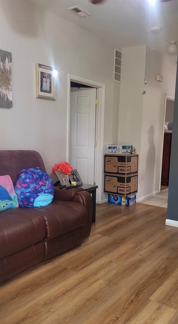 4751 S Hoyne Ave, Chicago, IL 60609 - living area with wood finished floors and baseboards