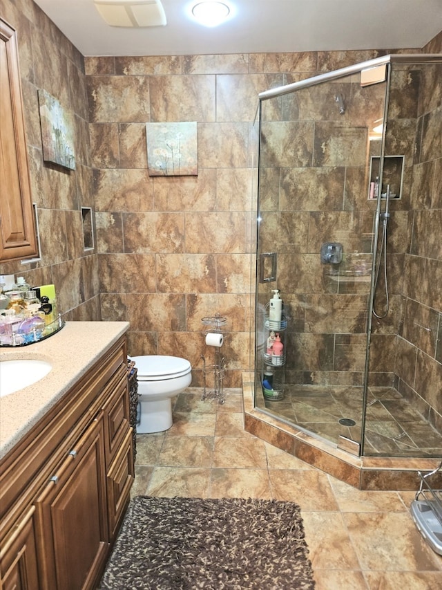 7108 Niles Ave, Niles, IL 60714 - full bath featuring vanity, tile walls, a stall shower, and toilet