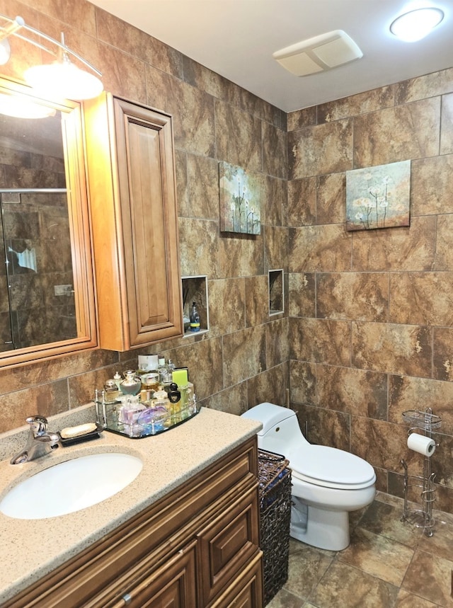 7108 Niles Ave, Niles, IL 60714 - full bathroom with tile walls, vanity, toilet, and a tile shower