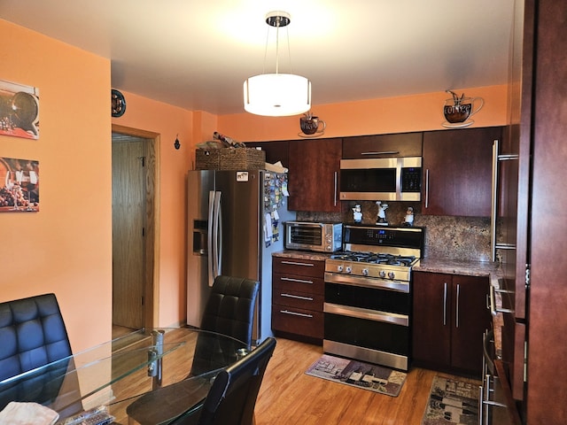7108 Niles Ave, Niles, IL 60714 - kitchen featuring stainless steel appliances, light wood finished floors, tasteful backsplash, and dark brown cabinets