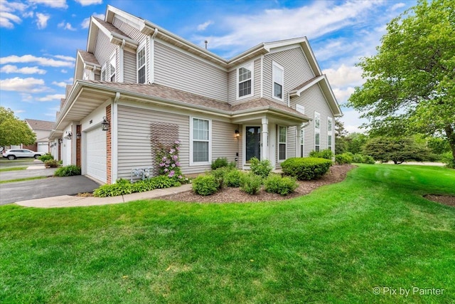 2040 Peach Tree Ln, Algonquin, IL 60102 - view of front facade with asphalt driveway, a front lawn, and a garage