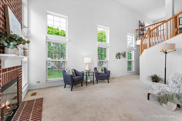 2040 Peach Tree Ln, Algonquin, IL 60102 - living area with a high ceiling, carpet floors, a fireplace, and stairway