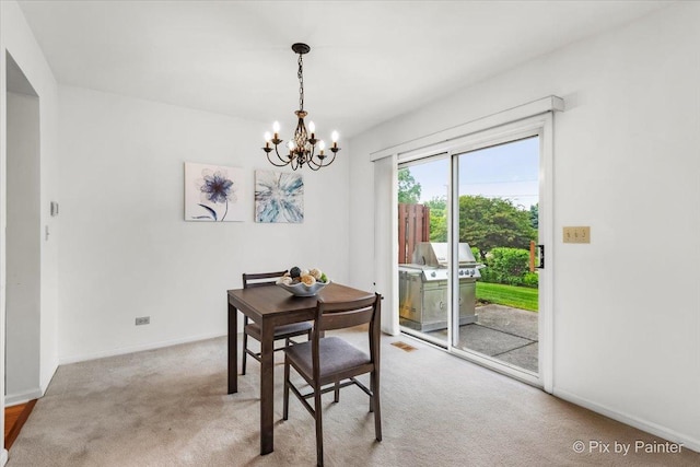 2040 Peach Tree Ln, Algonquin, IL 60102 - dining area featuring a chandelier, carpet flooring, and baseboards