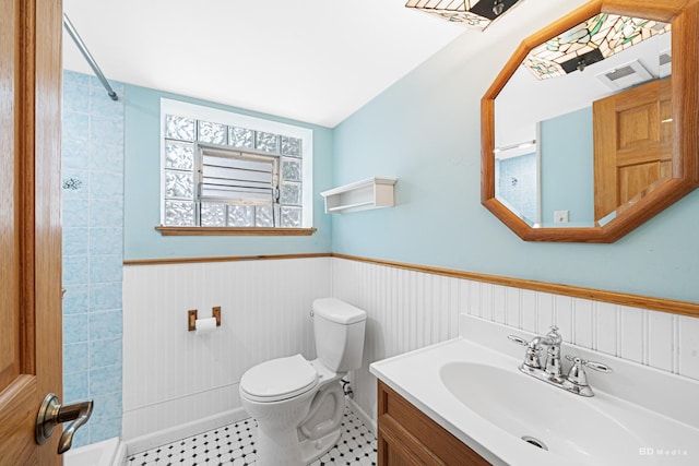 7043 W 73rd St, Nottingham Park, IL 60638 - full bathroom with vanity, a wainscoted wall, and bathing tub / shower combination