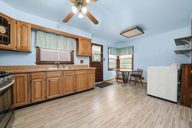 7830 S Kolmar Ave, Chicago, IL 60652 - kitchen with a sink, stainless steel stove, brown cabinetry, and ceiling fan