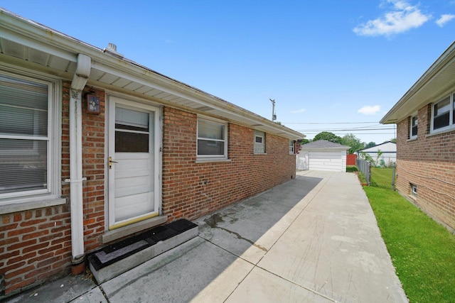 7830 S Kolmar Ave, Chicago, IL 60652 - view of patio featuring a garage and an outbuilding