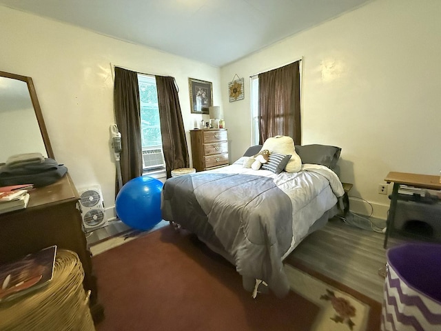 1229 W 6th St, Sterling, IL 61081 - bedroom featuring wood finished floors and vaulted ceiling