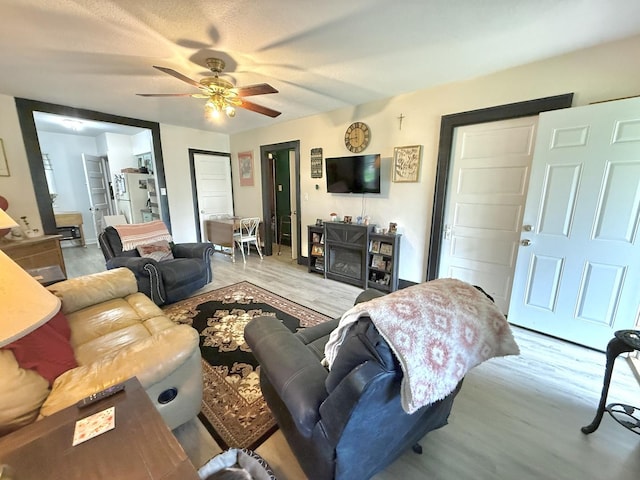 1229 W 6th St, Sterling, IL 61081 - living room featuring wood finished floors and a ceiling fan
