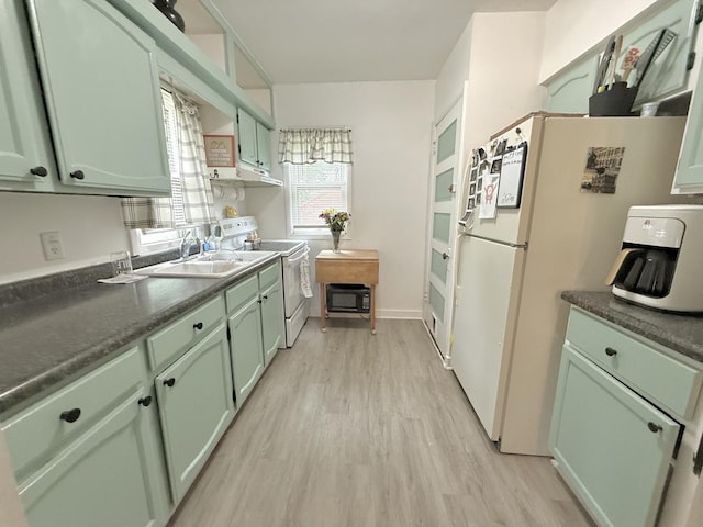 1229 W 6th St, Sterling, IL 61081 - kitchen with green cabinets, white appliances, and a sink