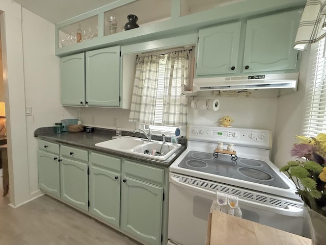 1229 W 6th St, Sterling, IL 61081 - kitchen with white range with electric cooktop, under cabinet range hood, green cabinetry, and a sink