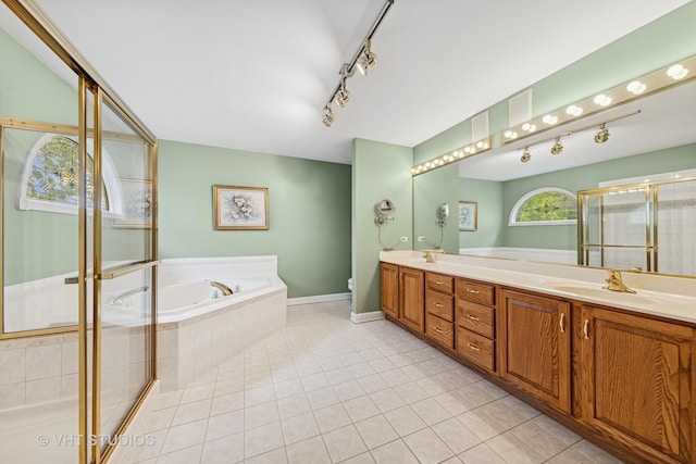 1051 Chadwick Ct, Aurora, IL 60502 - full bathroom featuring double vanity, a garden tub, a shower stall, tile patterned floors, and rail lighting