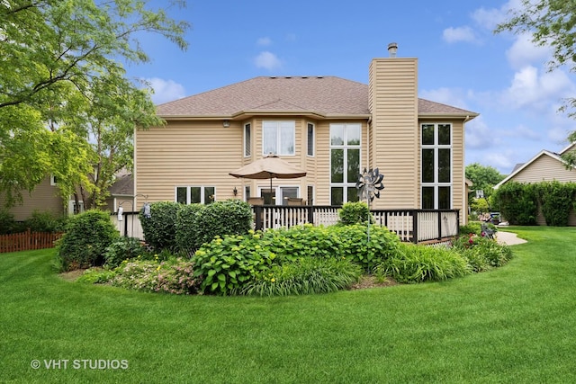 1051 Chadwick Ct, Aurora, IL 60502 - back of property featuring a yard, a chimney, a wooden deck, and a shingled roof