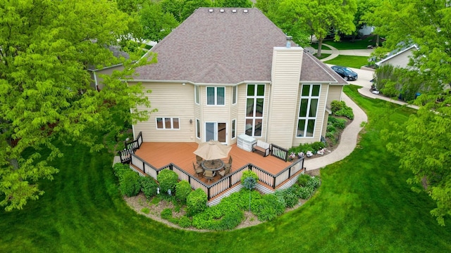 1051 Chadwick Ct, Aurora, IL 60502 - back of property with a wooden deck, a chimney, a yard, and roof with shingles