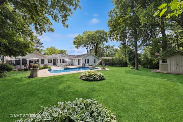 0S706 Madison St, Winfield, IL 60190 - view of yard with an outdoor pool, a storage unit, and a patio area