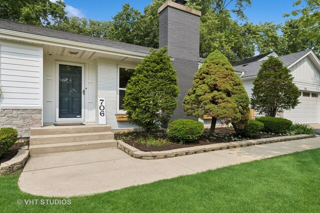 0S706 Madison St, Winfield, IL 60190 - property entrance with a chimney and a shingled roof