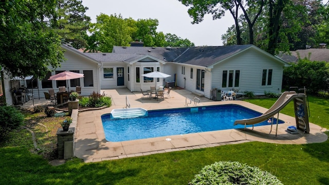 0S706 Madison St, Winfield, IL 60190 - swimming pool featuring a water slide, a patio area, a yard, and outdoor dining area