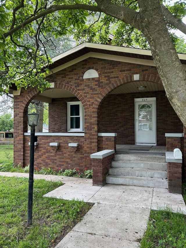 904 Johnson St, Streator, IL 61364 - view of front facade with brick siding and a porch