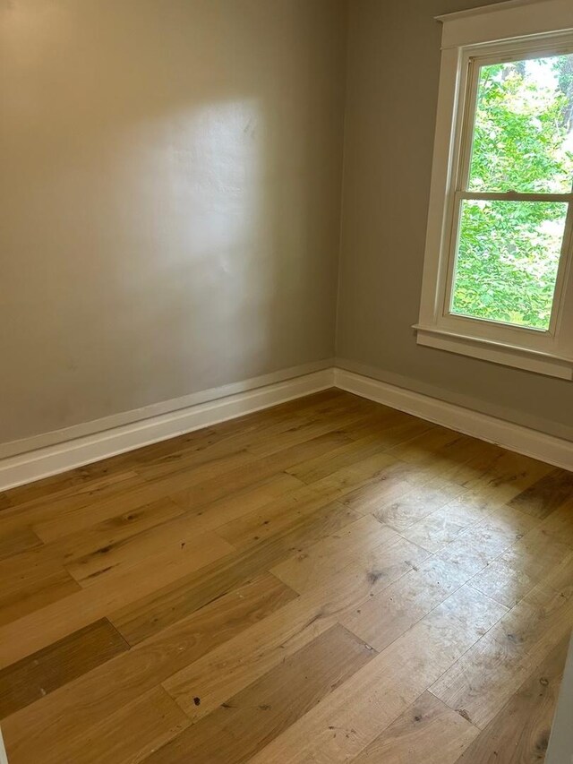 904 Johnson St, Streator, IL 61364 - empty room with hardwood / wood-style floors and baseboards