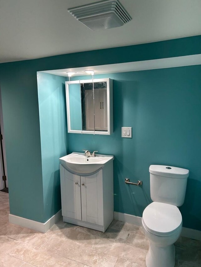 904 Johnson St, Streator, IL 61364 - bathroom with baseboards, vanity, and toilet